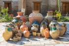 Bukhara, Uzbekistan, Central Asia. Variety of pots in a courtyard in Bukhara. Art Print